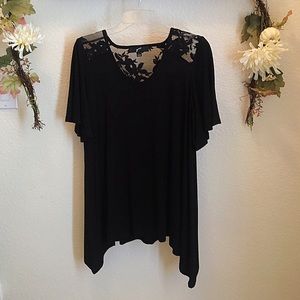 NWOT Beautiful black blouse with lace details.